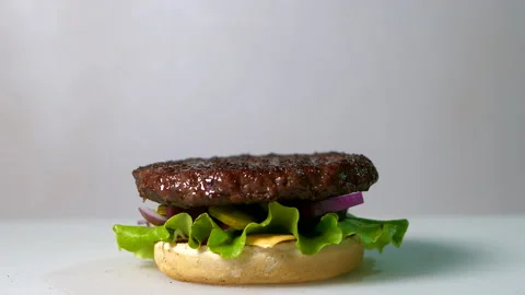 Appetizing burger on gray background Video stock 152419405