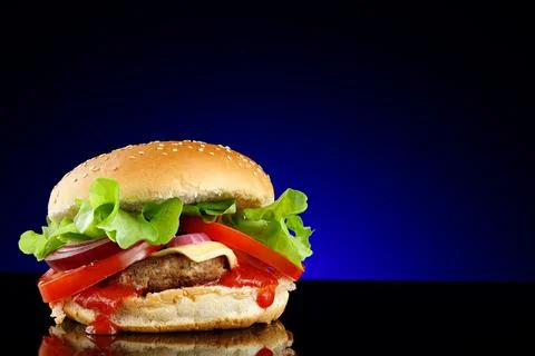 Appetizing burger place for text cope space. burger with lettuce, tomato, che Stock Photos