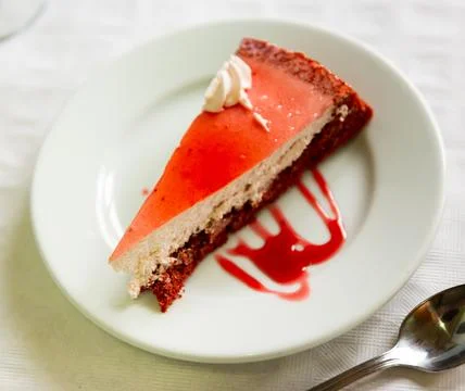 Appetizing cake with raspberry glaze on plate Stock Photos