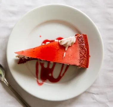 Appetizing cake with raspberry glaze on plate Stock Photos