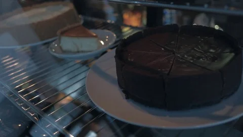 Appetizing cakes in showcase Stock Footage 84796759