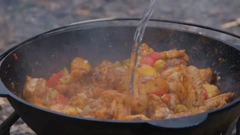 Appetizing chicken fried in a slow motion cauldron. Juicy chicken in a cauldron Stock-Footage 278463223