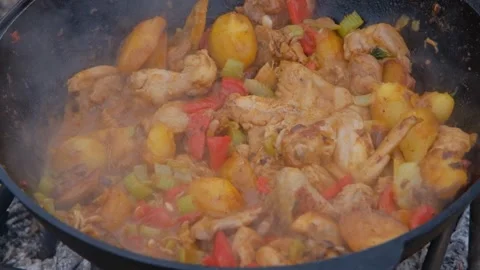 Appetizing chicken fried in a slow motion cauldron. Juicy chicken in a cauldron Stock Footage 278868679