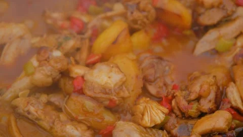 Appetizing chicken fried in a slow motion cauldron. Juicy chicken in a cauldron Stock Footage 279271917