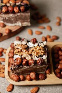 Appetizing chocolate halva cake decorated with assorted nuts 스톡 사진
