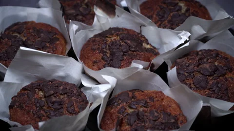 Appetizing Chocolate Muffins are Spinning in a Plate Close-up Stock Footage 236414233