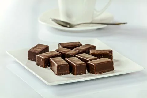Appetizing chocolates with coffee Stock Photos