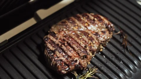 Appetizing chuck eye roll steak ready to eat, juicy grilled marinated meat. Video stock 121875506