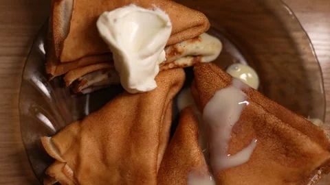 This appetizing close-up shot captures a rustic serving of golden-brown Stock Footage 329989312