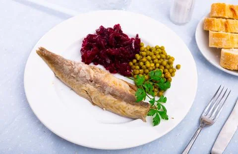 Appetizing cold smoked mackerel with peas and beets Stock Photos