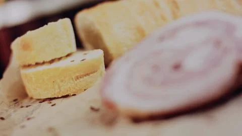 Appetizing cooking process view: slicing fresh bread and sandwich ingredients Stock Photos