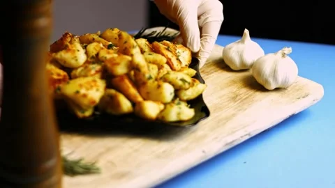 Appetizing creamy mashed potatoes served from a rustic clay pot in tabletop, 4K Stock Footage 341103131