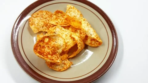 Appetizing crispy snack chips in a simple bowl footage Video stock 329909970