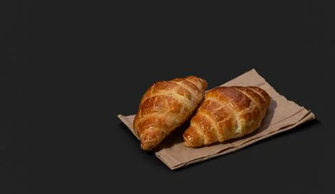 Appetizing croissants on a black background Stock Photos