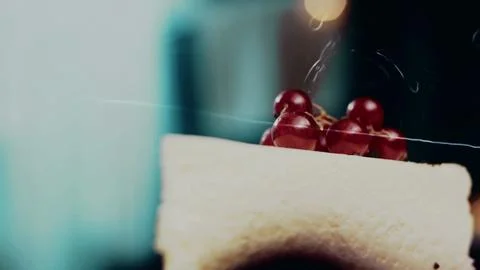 Appetizing culinary presentation: framing red currants on a layered dessert 스톡 사진