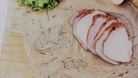 Appetizing culinary workflow: slicing fresh bread and sandwich ingredients Stock Photos