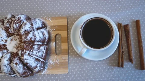 Appetizing cupcake and cups with coffee on the table Stock Footage 142008458