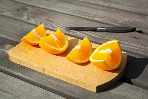 Appetizing cutted pieces of orange Stock Photos