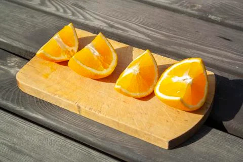 Appetizing cutted pieces of orange Stock Photos