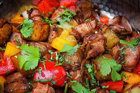Appetizing Eastern-style Braised Veal and Potato Dish with Fresh Parsley and Stock Photos