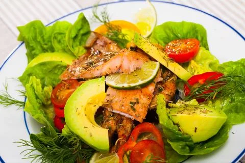 Appetizing fish salad with roasted trout Stock Photos