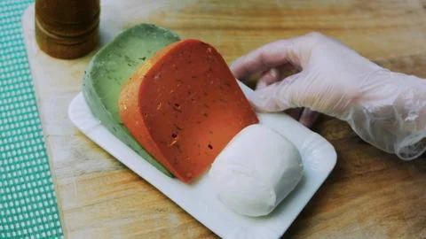Appetizing food preparation: grating fresh carrot for a side dish Stock Photos