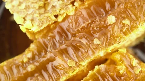Appetizing fresh honey in combs, close-up rotation. Top view. 動画素材 136236043