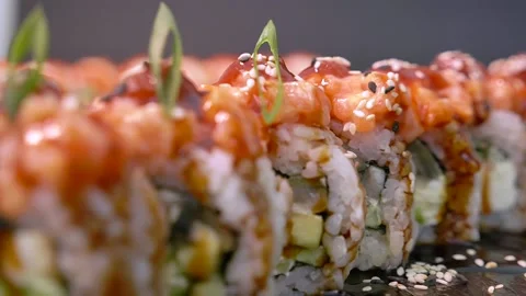 Appetizing fresh sushi set with salmon, shrimp, unagi, sesame seeds. Stock Footage 156967080