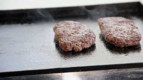 Appetizing fried beef patties on a grill pan Stock Footage 50180106