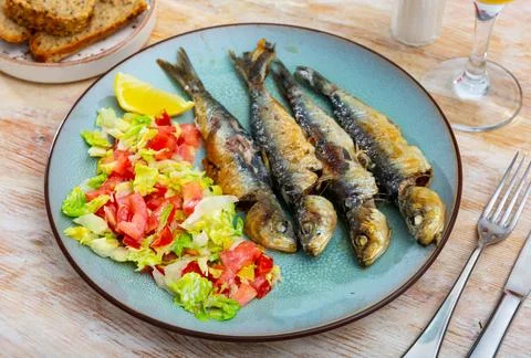 Appetizing fried sardines Stock Photos