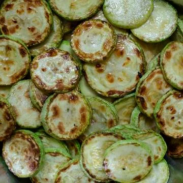 Appetizing fried zucchini background. Stock Photos