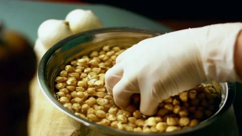 Appetizing gloved cook carving golden roasted poultry in closeup, 4K Stock Footage 341105972