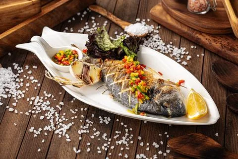 Appetizing grilled fish Stock Photos