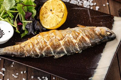 Appetizing grilled fish Stock Photos