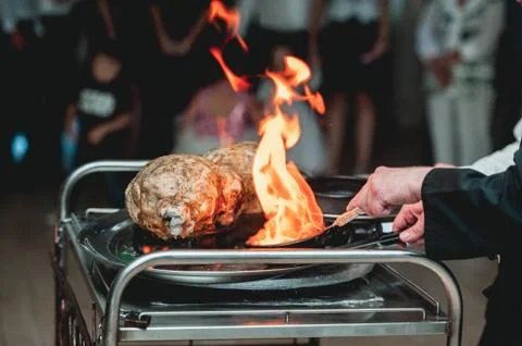 Appetizing grilled meat on fire close-up. beautiful presentation of the dishes Stock Photos