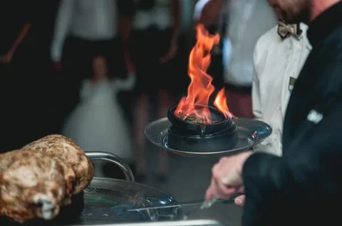 Appetizing grilled meat on fire close-up. beautiful presentation of the dishes Stock Photos