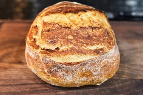 Appetizing home made loaf of bread cooling on the countertop Fotos de archivo