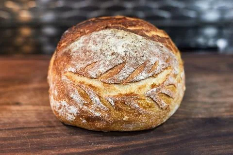 Appetizing home made loaf of bread cooling on the countertop Stock Photos