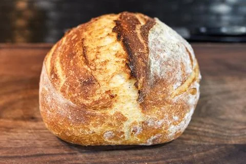 Appetizing home made loaf of bread cooling on the countertop Stock Photos
