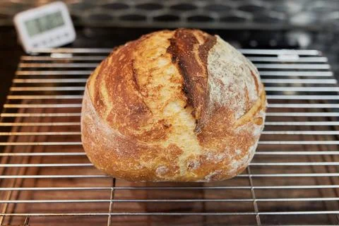Appetizing home made loaf of bread cooling on the countertop Stock Photos