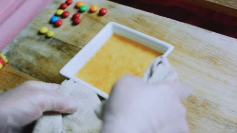 Appetizing ingredient study of golden flan cooling in a square dish Stock Footage 342154054