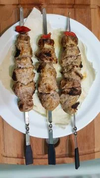 Appetizing kebab with bell pepper on white plate, close up. barbecue on a white Stock Photos