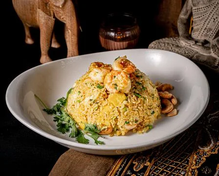 Appetizing Khao Pad Saparod served on a white plate Stock Photos