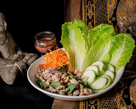 Appetizing Larb Wrapss served on a white plate Stock Photos