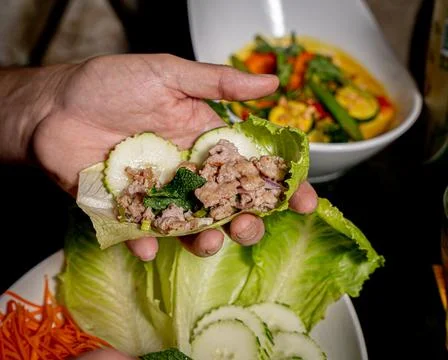Appetizing Larb Wrapss served on a white plate Stock Photos