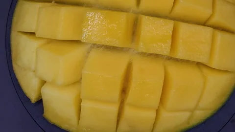 Appetizing large mango cut into cubes Stock Footage 329647906
