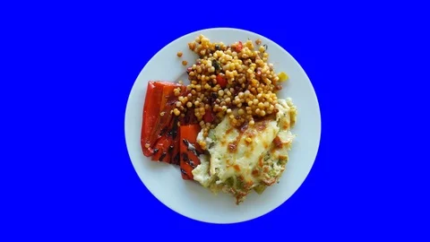 Appetizing mashed potatoes with slices of stewed vegetables. White spinning p Stock Footage 119520641