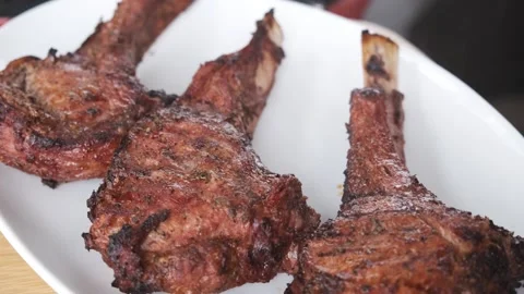 Appetizing meat steak on a white plate. Serving rosemary steak. Close up Stock Footage 131023476