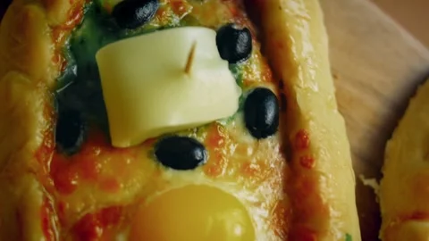 Appetizing minced meat mixture spread over fresh pide dough in macro, 4K Stock Footage 341114479
