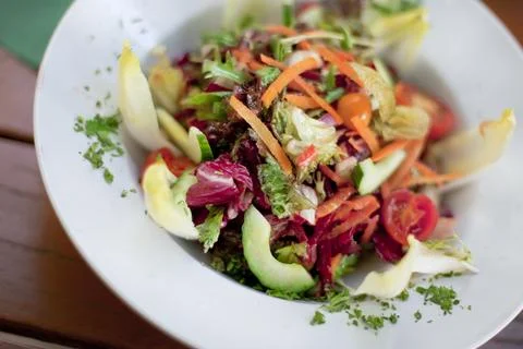 Appetizing mixed salad on a plate Stock Photos